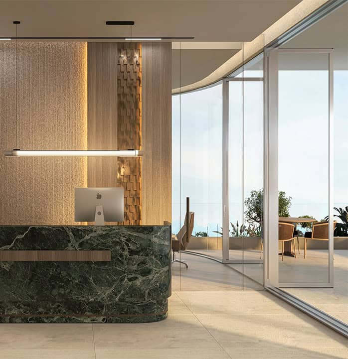 Modern office reception with glass walls, sleek design, and scenic outdoor view, ideal for commercial property excellence.