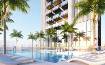 Luxury beachfront pool with modern high-rise apartments and lush palm trees at Address Point Properties.