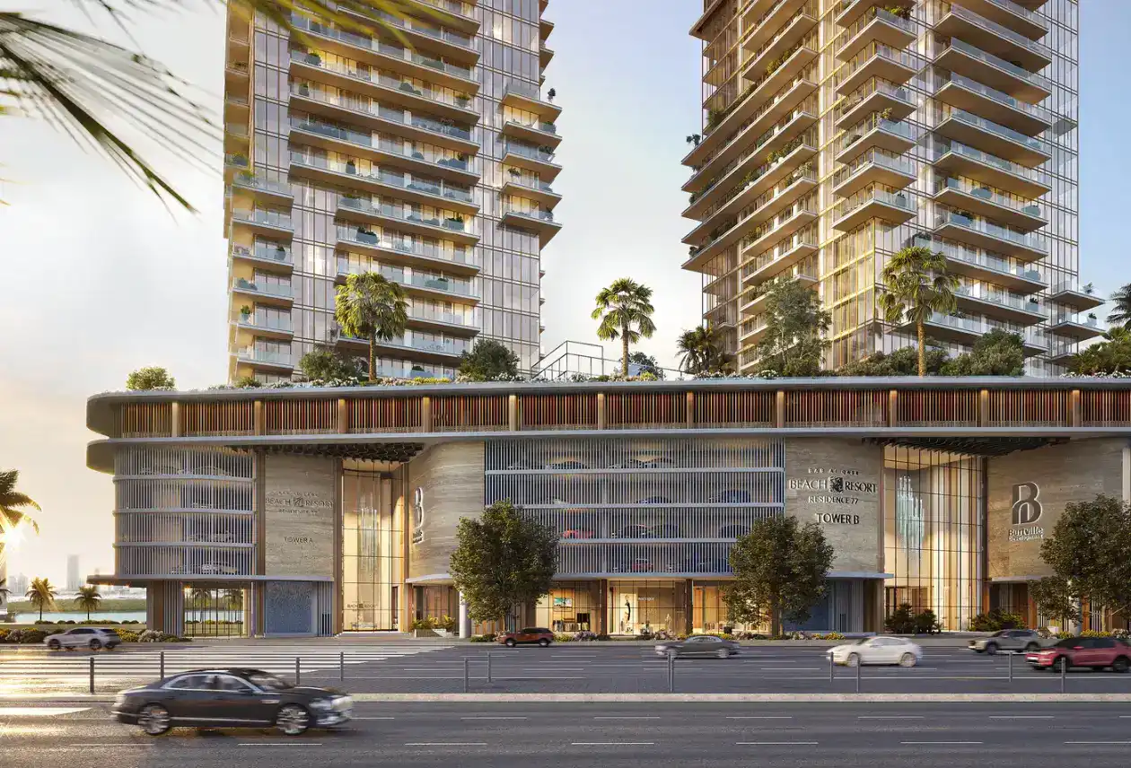 Main entrance and travertine-clad podium of Bab Al Qasr Beach Resort Residence 77