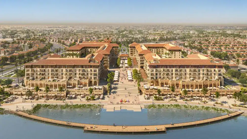 Aerial render of Bloom Living by Bloom Holding beside the lake in Zayed City, Abu Dhabi