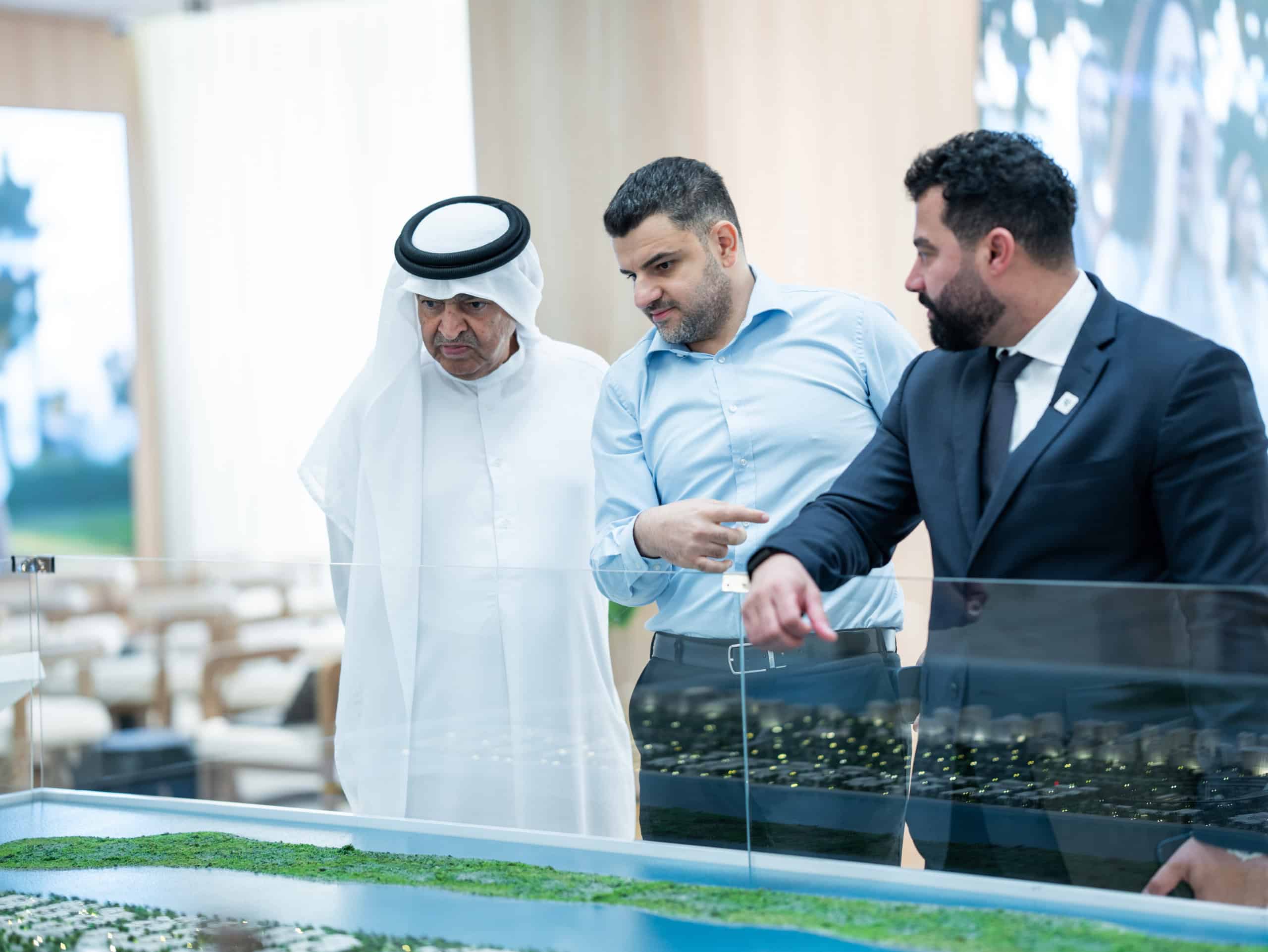 Address Point Properties agents presenting an Aldar masterplan model to an HNI investor at the Aldar Roadshow in Abu Dhabi