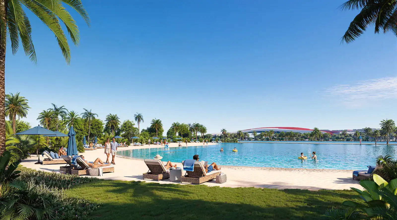 Crystal lagoon with beach and palm trees at Manchester City Yas Residences